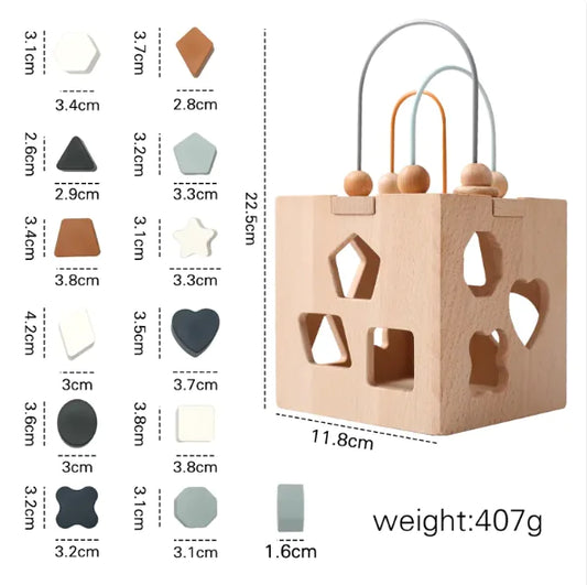 The perfect preschool learning toys. A box with shape patterns cut in it where the wooden peg shapes fit.